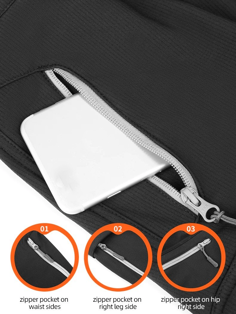 Close-up of black hiking pants with secure zipper pockets, ideal for outdoor adventures, demonstrating functionality and convenience.